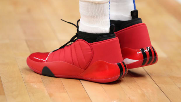 View of red and black adidas shoes.